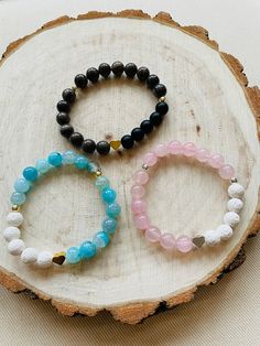 *If you are ordering a bracelet, measure your wrist and add 1/2 inch for a perfect/snug fit or 1 inch if you like a little more space.     Using all 8mm, high quality gemstones, this "Adore" Bracelet is made with either Agate, Rose Quartz, Petrified Wood, Black Glass beads, and Lava Stones.  We have added a silver or gold heart charm and gold or silver plated hematite beads also.  Strung on strong, stretchy cord, designed by us! Banded Agate Diffuser Bracelet: Agate is a stone of strength, groun Lava Stone Bracelet, Essential Oil Diffuser Bracelet, Lava Bracelet, Energy Bracelets, Diffuser Bracelets, Mala Bracelet, Bracelet Ideas, Glass Bracelet, Hematite Beads