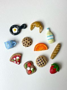 several different types of cookies and pastries on a white surface