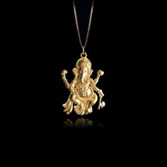 Elevate your faith with our 14k Gold Ganesh Pendant, symbolizing wisdom and prosperity in Hinduism. This solid gold Ganesh necklace captures the essence of the Elephant God. The 14 karat gold Ganesh pendant is more than just jewelry; it's a fine religious symbol that resonates with those seeking a connection to Hindu heritage. Explore our collection of Ganesh-themed jewelry, including elegant gold medallions, also available in 14k yellow gold. PENDANT INFORMATIONThis pendant is made of real, solid gold.• Made in USA• Material: 14k or 18k solid gold• Finish: polished• Height: 1.25" (32 mm) | *includes the small circle, bail dimensions not included• Width: 0.9" (22,5 mm)• Pendant weight: approx. 6 grams (14k)• Bail: fits up to 4 mm chains• Solid back, not hollow• A certificate of authenticit Festival Yellow Gold Jewelry With Large Pendant, Yellow Gold Temple Jewelry With Large Pendant, Spiritual Yellow Gold Festive Jewelry, Yellow Gold Locket Jewelry For Festivals, Festival Yellow Gold Locket Jewelry, Spiritual Gold Plated Jewelry For Diwali, Spiritual Gold-plated Jewelry For Diwali, Yellow Gold Temple Necklace With Pendant For Celebration, Gold Spiritual Temple Necklace For Celebrations