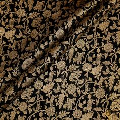 black and gold brocaded fabric with floral design