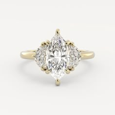 an oval cut diamond ring with three pear shaped diamonds