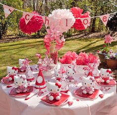 a table with hello kitty decorations on it