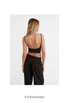 Strappy top with a square neckline. Open back detail. Available in several colours. Chic Crop Top With Built-in Bra And Minimal Stretch, Sleek Tops With Built-in Bra And Scoop Neck, Chic Crop Top Camisole With Built-in Bra, Trendy Square Neck Top With Built-in Bra, Chic Scoop Neck Crop Top With Built-in Bra, Casual Seamless Backless Top, Chic Fitted Camisole With Built-in Bra, Chic Seamless Scoop Neck Top, Chic Tops With Minimal Stretch And Bra Friendly