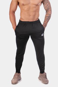 Matrix Tapered Joggers - Black Joggers Jed North Fitted Black Joggers With Pockets, Black Fitted Joggers With Pockets, Fitted Black Sweatpants With Ribbed Waistband, Fitted Black Joggers With Side Pockets, Cotton Training Bottoms With Pockets, Black Tapered Leg Sweatpants For Gym, Black Tapered Joggers With Hip Pockets, Fitted Sports Sweatpants With Side Pockets, Casual Training Bottoms With Ribbed Waistband