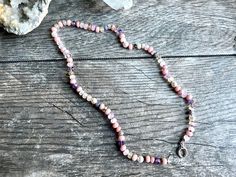 Ombre pink gemstone candy necklace. This lovely, delicate gemstone necklace contains gemstones in shades of pastel pink and purple with occasional hints of golden yellow. Peruvian opal, moonstone, lavender moonstone, citrine, amethyst, freshwater pearl, morganite, agate, lavender opal, rhodochrosite, and spinel. Finished with a sterling silver clasp. The gems in this necklace are a more delicate 5-6mm size, and are individually hand knotted onto rose colored silk. Necklace is about 18.25 inches Beaded Pink Opal Necklaces For Jewelry Making, Pink Opal Beaded Necklace For Gift, Handmade Spiritual Pink Beaded Necklaces, Handmade Pink Spiritual Beaded Necklace, Pink Hand-strung Necklace As Gift, Pink Hand-strung Necklace For Gift, Pink Gemstone Bead Necklaces, Pink Opal Single Strand Beaded Necklace As Gift, Pink Round Gemstone Beads Necklace