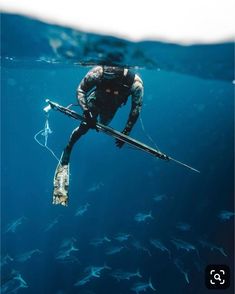 a man is in the water with his skis and poles attached to his body