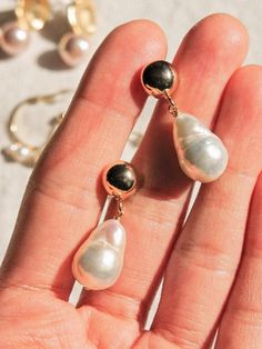 This piece is part of the Déjà Vu collection. Gemstone(s): Freshwater Pearl Earrings full size: 28 x 9 mm (top to bottom) Metal material: 14K gold plated post earrings, 14K Gold Fill wire This item will be ready to ship in 1 - 3 business days. 14k Gold-filled Pear-shaped Pearl Drop Jewelry, Delicate Gold Teardrop Pearl Earrings, Tarnish Resistant Round Pearl Earrings For Wedding, Teardrop 14k Gold Filled Wedding Jewelry, Round Tarnish Resistant Pearl Earrings For Wedding, Gold Pear-shaped Bridal Earrings With Pearl Charm, Round Tarnish-resistant Pearl Earrings For Weddings, Vintage Teardrop Jewelry For Anniversary, 14k Gold Filled Pear-shaped Pearl Drop Jewelry