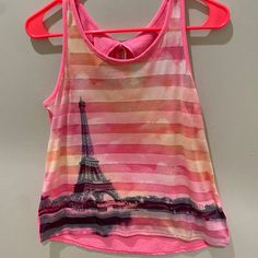 Adorable "Meet Me In Paris" Tank , Flows Wider At The Bottom Sides, Cute Tie In The Back, Tag Are Not Attached But Top Was Never Worn Pink Tank Top For Playwear In Summer, Pink Tank Top For Playwear And Summer, Pink Tank Top For Summer Playwear, Fun Pink Sleeveless Tank Top, Cute Pink Tank Top For Playwear, Playful Pink Tank Top For Spring, Multicolor Sleeveless Tops For Playtime, Pink Sleeveless Tank Top For Play, Cute Pink Tops For Playwear