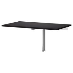 a black table sitting on top of a white floor next to a metal frame and legs