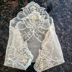 RARE FIND Vintage embroidered lace handkerchief in ivory color. Unique floral embroidered in every corner. It is decorated with sequences, pearls, beads, and rhinestones. This is a collectible mid-century shabby chic hankie. Bridal wedding handkerchief or something old. Size:'9.5" x 9.5" Excellent condition. Perfect gift. Thank you for visiting my store. You can also visit my MargaretJewelryShop or AmazingClosetShop Elegant White Handkerchiefs With Crochet Lace, Elegant White Handkerchiefs With Lace Work, Elegant Lace Handkerchiefs With Lace Trim, Lace Handkerchiefs With Lace Trim For Wedding, Elegant White Lace Handkerchiefs, Lace Wedding Handkerchiefs With Lace Trim, Lace Wedding Handkerchiefs With Lace Work, Cream Embroidered Lace For Ceremony, Elegant Cream Lace With Intricate Embroidery