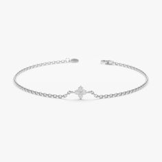 Amy Embrace a touch of timeless elegance and subtle sparkle with this Minimalist Natural Diamond Clover Bracelet. This captivating bracelet is crafted from high-quality 14k gold (available in yellow, rose, or white gold) and features a dainty four-leaf clover charm. Four sparkling diamond bezels adorn the clover, symbolizing luck and prosperity. The intricate design creates a touch of shimmer, making this bracelet a perfect everyday accessory or a meaningful addition to a layered look. - Handmad White Gold Diamond Bracelets, Tarnish Resistant, White Gold Diamond Bracelet, Tarnish Resistant, Tarnish Resistant White Gold Diamond Bracelet In Sterling Silver, Tarnish Resistant White Gold Diamond Bracelet, Tarnish-resistant White Gold Sterling Silver Diamond Bracelet, Elegant Round Diamond Bracelet, Tarnish Resistant, Elegant Round Diamond Bracelet With Solid Link Construction, Elegant Round Diamond Bracelet With Solid Link, Elegant Adjustable Sterling Silver Bracelet With Solid Link