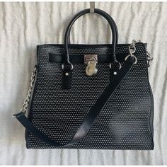 Michael Michael Kors Black Studded Leather Ns Hamilton Satchel Satchel Is In Good Condition (Other Than Some Scuffs On The Hardware) And Comes From A Smoke Free And A Pet Free Home. Length 13 Inches Height 12.5 Inches Depth 6 Inches Baghdad Top Handles, A Shoulder Strap, A Magnetic Snap Closure, An Interior Zip Pocket And Interior Slip Pockets. Bag Has Silver Toned Studs And Hardware. Baghdad, Studded Leather, Michael Kors Black, Michael Kors Bag, Snap Closure, 6 Inches, Black Silver, Zip Pockets, Satchel