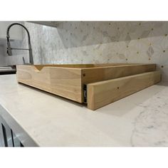 a wooden box sitting on top of a counter