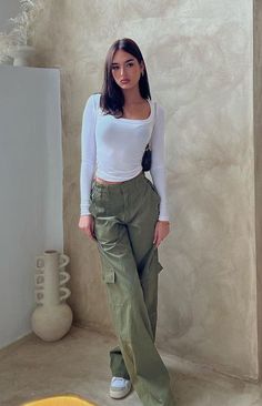 Khaki Low Rise Cargo Pants
These low rise khaki pants are super cool and stylish! Grab sunnies and a bag for an off duty fit that you're sure to love. Be sure to pair with a cute crop and gold jewellery to complete this look! 

Elasticated waistline
Zip closure on the front
Unlined
Full length
Belt loops
6 pockets- 4 on the front, 2 on the back 6 Pocket Pants Outfit For Women, Cargo Pants With T Shirt, 6 Pocket Cargo Pants, Low Rise Cargo Pants, Pakaian Hipster, Cargo Outfit, Shop Pants, Cargo Pants Outfit, Summer 22