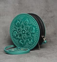 Elevate your accessory game with this stunning handmade round leather bag for women.  Crafted from premium genuine calf leather, this leather evening bag is the epitome of luxury and style. The unique embossing technique used to create this mint green round bag gives it a one-of-a-kind look that is sure to turn heads.  Whether you're heading to a special occasion or simply need a stylish daily bag, this cross body bag is the perfect choice. This everyday bag is not just a fashion statement, but Round Bags As Gift, Leather Bags With Round Handle For Gifts, Leather Round Case Shoulder Bag As Gift, Leather Round Case Shoulder Bag, Handmade Round Shoulder Bag For Everyday Use, Handmade Round Bag For Everyday Use, Daily Purse, Embossing Techniques, Embossed Bag