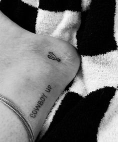 a black and white photo of someone's foot with the words comfort life written on it