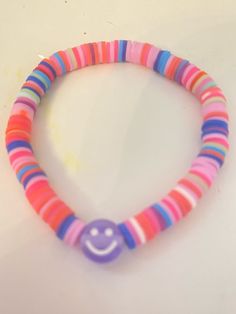 A fun cute handmade bracelet!! Cheerful Handmade Adjustable Bracelets, Cheerful Adjustable Multicolor Friendship Bracelets, Cheerful Multicolor Adjustable Friendship Bracelets, Cheerful Handmade Adjustable Beaded Bracelets, Playful Pink Bracelets For Festivals, Playful Pink Bracelets For Festival, Playful Pink Festival Bracelets, Playful Pink Friendship Bracelets For Festivals, Playful Handmade Pink Wristband