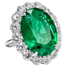 Classic green emerald diamond ring with center gia certified 23.98 natural green emerald/oval shape set with 4.25ct of round diamonds all around in platinum. Diana M. is a leading supplier of top-quality fine jewelry for over 35 years. Diana M is one-stop shop for all your jewelry shopping, carrying line of diamond rings, earrings, bracelets, necklaces, and other fine jewelry. We create our jewelry from gemstones and diamonds of the highest quality (GIA certified) as well as the highest quality Green Jewellery, Jewelry Beauty, Emerald Rings, Diamond Earrings Studs Round, Emerald Diamond Ring, White Gold Wedding Rings, Round Diamond Engagement Rings, White Gold Diamond Rings, Classic Jewelry