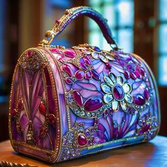 Welcome to my high-concept designer handbag art, intended for the wall or a shelf, possibly as part of a retail display.  Art Description: This exquisite handbag concept exudes a sense of grandeur, reminiscent of antique stained glass windows infused with modern opulence. Its primary color palette is dominated by rich purples, ranging from lavender to deep violet, accented by bold crimson and fuchsia jewels. The floral motifs, particularly the prominent daisy with a radiant gem at its center, bring a whimsical and organic touch to the structured, barrel-like silhouette of the handbag. The intricate craftsmanship is evident in the delicate filigree that frames each section of the bag, with golden lines outlining the stained glass-like segments, imbuing it with a luxurious and ornate feel. T Elegant Hand Painted Rectangular Bags, Elegant Hand Painted Rectangular Bag, Artistic Rectangular Evening Bag, Glass Concept Art, Primary Color Palette, Antique Stained Glass Windows, Antique Stain, Art Description, Designer Handbag