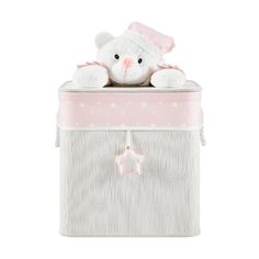 a white teddy bear sitting on top of a pink and white box with stars around it