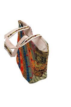 This stunning Artisan tote bag is a true celebration of Indian craftsmanship. The bag features a vibrant and eclectic patchwork design, adorned with intricate Indian gold zari embroidery and shimmering mirrors. Inspired by the nomadic Banjara tribes, this banjara shoulder bag is a perfect blend of tradition and contemporary style. Each piece is meticulously handcrafted, making it a unique and one-of-a-kind accessory. The bag's spacious interior provides ample room for your essentials, while the Multicolor Shoulder Bag For Travel And Festival, Multicolor Embroidered Bags For Daily Use And Festivals, Multicolor Shoulder Bag For Daily Use And Festivals, Travel Tote Shoulder Bag For Festivals, Festival Multicolor Embroidered Bags For Daily Use, Handmade Multicolor Bags For Festivals, Multicolor Handmade Bags For Festivals, Multicolor Shoulder Bag For Festival Travel, Bohemian Multicolor Shoulder Bag For Shopping