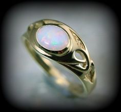 You are a big fan of art nouveau like i am, you'll love this piece ; there is elegancy and a flair of mystery with this style that makes it unique. Here is a ring i create recently to honor this style. The ring is made in solid 10 k or 14 k gold with a beautiful opal. You can order with another stone by sending me a message.  ring dimensions on the top : 10 mm band dimensions : 2 mm Because the environment means a lot to me just like you, all my jewelry is sent with the recyclable material, such as paper bags and boxes of jewels made with 100% recycled cardboxes made with 77% post-consumer fiber and 23% pre-consumer fiber. Also I use small biodegradable plastic bags. I print your invoices on ecological certified paper, earth choice Elegant Gold Opal Cabochon Ring, Antique 14k Gold Moonstone Ring Gift, Gold Opal Ring In 14k, Unique Gold Opal Ring In 14k, Antique Opal Jewelry In Yellow Gold, Elegant Opal Cabochon Ring, Elegant Oval Cabochon Opal Ring Gift, Elegant Opal Oval Cabochon Ring Gift, Elegant Opal Ring With Oval Cabochon