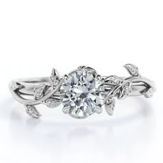 a white gold engagement ring with an intricate design