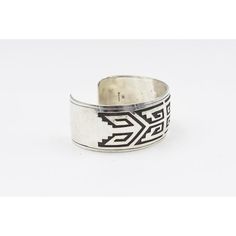 This is part of Chairish’s Costume Jewelry assortment.  Vintage Native American sterling silver  bracelet cuff handmade and designed by Jacob Kahe. The front has a polished finish and the back has a satin finish.  It is marked Sterling with Jacob Kahe's hallmark.  Interior of the cuff measures 5 1/2"with an additional 1 " gap for a total circumference of 6 1/2".  Sterling Silver is relatively malleable, thus this cuff is slightly adjustable. Width measures 2.41" straight across the widest part(from wrist bone to wrist bone). Bracelet face measures .95" tall (the face of the bracelet, north to south). Bracelet depth from top the underside of wrist is 1.86". Classic Ceremonial Cuff Bangle Bracelet, Classic Ceremonial Cuff Bracelet Styled As Bangle, Silver Etched Cuff Bracelet, Silver Open Cuff Bracelet With Polished Finish, Silver Engraved Wide Band Bangle, Etched Silver Cuff Bracelet, Silver Open Band Bangle With Polished Finish, Traditional Stamped Cuff Bracelet For Formal Wear, Traditional Stamped Cuff Bracelet For Formal Occasions