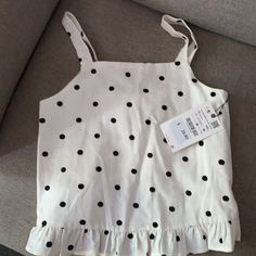 Nwt Polka Dot Zara Girl’s Top With Ruffles On The Bottom. 100% Cotton, Linen Like Cute Polka Dot Sleeveless Top, Cute Polka Dot Top For Spring, Cute Spring Polka Dot Tops, Spring Polka Dot Cotton Tops, Cute Zara Tops For Summer, Trendy Polka Dot Cotton Tops, Polka Dot Sleeveless Cotton Top, Sleeveless Polka Dot Cotton Tops, Sleeveless Polka-dotted Cotton Top