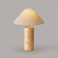 SUMMARY Elevate your space with the Starr Wood Table Lamp from Mooijane. Crafted with a walnut or natural wood base and a sleek brass neck, its classic design exudes an air of sophistication. The textured beige shade emits a warm, homey glow, perfect for creating a serene atmosphere. STANDARD SIZE (PICTURED) Size: Dia 35cm x H 48cm / ∅ 13.7″ x H 18.8″ DETAILS Material: Brass, Wood, Fabric. Body Color: Walnut Color, Wood Color, Brass. Shade Color: White. Modern style. Type: Table Lamp. Be applica Wood Table Lamp, Coastal Lighting, Brass Wood, Table Lamp Wood, Brass Lighting, Entry Foyer, Body Color, Chandelier Pendant Lights, Body Colour