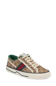 Gucci serves up some heritage style with a low-top sneaker branded with Web striping, double-G sole embossing and retro sport labels at the tongue and footbed. Style Name:Gucci Tennis 1977 Platform Sneaker (Women). Style Number: 6002528. Available in stores. Gucci Low-top Sneakers With Logo, Gucci Low-top Platform Sneakers With Branded Insole, Gucci Low-top Sporty Sneakers, Gucci Sporty Low-top Sneakers, Gucci High-top Logo Sneakers, Gucci High-top Sneakers With Logo, Designer Gucci Platform Sneakers With Round Toe, Gucci Designer Platform Sneakers With Round Toe, Gucci Sneakers With Logo And Round Toe