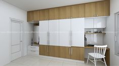 a white chair sitting in front of a kitchen with wooden cabinets and cupboards on the wall