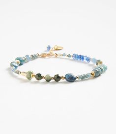 Polish your look with this unique Bohemian-inspired bracelet that is crafted from natural green moss and blue kyanite. Material: Green moss and Blue Kyanite stones Dimensions: 7.5"L, 1" extender Made in USA Due to the natural characteristics of this item, each piece will have variances, no two are exactly the same. Beaded Gemstone Bracelets, Kyanite Bracelet, Bracelet Inspiration, Group Gifts, Diy Bracelet Designs, Blue Kyanite, Bracelet Ideas, Diy Bracelet, Artistic Jewelry