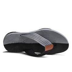 The sturdy yet flexible sole ensures stability and durability. Whether you're lounging at home or stepping out for a casual outing, these slippers offer a cozy and versatile option for your feet. Comfortable Non-slip Slip-ons For Outdoor, Synthetic Slip-on Slippers With Textured Sole, Black Non-slip Slippers For Beach, Comfortable Black Slip-ons With Rubber Sole, Black Slip-ons With Arch Support, Black Round Toe Slip-ons For Beach, Casual Outdoor Slip-on Slides, Casual Gray Slip-on Flip Flops, Comfortable Slip-on Slippers For Outdoor