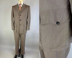 Look your best while out on the range or at a roundup in this 1940s western-flavored suit! Sturdy whipcord fabric in hazel taupe/brown. Jacket features a sought after single-breasted peak lapel cut with three leather knot button closure with matching buttons at the cuffs and matching buttons closing the two bellows flapped patch pockets at the hips. Jacket also includes bi-swing action back, two jetted chest pockets, one inner pocket, single vent, fully lined with shoulder pads. Trousers have five pockets with both back pockets featuring peaked flaps and button-closure, flat front, metal zip and button closure and belt loops. By Fechheimer of Cincinnati, Ohio, originally tailored for M Hazeltine and includes a 1940s-era Union Label.  This suit is in great vintage condition, with a couple t Retro Fitted Suits With Pockets, Vintage Suits With Welt Pockets, Vintage Brown Suit With Welt Pockets, Vintage Brown Suits With Welt Pockets, Peak Lapel Suit, Knot Button, Suit Vintage, Vintage 40s, Peak Lapel