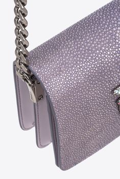 Mini Love Bag Click in buffed stingray leather, which is slightly coarse to the touch and very shiny. The concealed press-stud fastening is accompanied by the iconic Love Birds Diamond Cut metal buckle, complete with a cut-out effect and pavé rhinestone detail. Inside, it features contrasting lining, a slip pocket and a zipped divider pocket. The shoulder strap combines the classic round-link chain with a practical, adjustable leather pad. The bag is part of the Limited Edition special capsule c Elegant Bag In Textured Caviar Leather, Elegant Bags In Textured Caviar Leather, Designer Caviar Leather Bags For Formal Occasions, Luxury Caviar Leather Evening Bag, Elegant Textured Caviar Leather Bag, Luxury Top Handle Bag With Pebbled Texture, Designer Caviar Leather Bag With Textured Finish, Luxury Formal Bags With Pebbled Texture, Designer Bags In Textured Caviar Leather