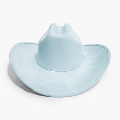 Light Blue Cowboy Hat by AB.LINO Western meets contemporary. Our take on a western classic, made from the same materials used on our flagship rancher hat. Trimmed with a Minimal Mexican Suede Hat Band. Made from stiffened Mexican suede Spot / specialist clean Brim width: 4″ / 10.16 cm Crown height: 4″ – 4.75″ Rigid crown design Please note: due to the color and nature of the suede dyeing process, some flecking or marks may be present in material Size & Fit: Our Cowboy hat is designed one-size-fi Blue Cowboy Hat, Suede Hat, Rancher Hat, Crown Heights, Crown Design, Big Sky, Fall Favorites, Dyeing Process, Hat Band