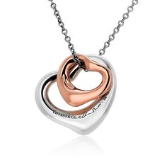 This is part of Chairish’s Fine Jewelry assortment.  Elevate your style with the timeless elegance of the Tiffany & Co. Double Open Heart Necklace. Crafted with precision and love, this exquisite piece combines the warmth of rose gold and the sophistication of silver to create a stunning visual contrast. With two open heart pendants, each measuring 0.50 inches and 0.55 inches, this necklace is a symbol of love, connection, and grace.  Signed: Tiffany & Co Elsa Peretti 750 SPAIN This necklace is Tiffany Necklaces, Tiffany And Co Necklace, Necklace C, Open Heart Necklace, Tiffany Necklace, Heart Necklaces, Jewelry Instagram, Love Connection, Heart Pendants