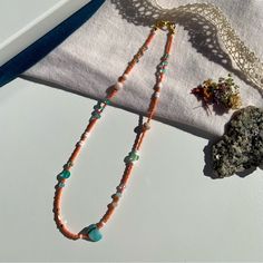 Handmade By Penelope’s Dezines Artisan Jewelry Created To E L E V A T E Your >> Personal Adornment << & A C C E N T U A T E Your >> Natural Beauty << A Coastal Dream. Step Into Your Eternal Summer Era With This Bright And Fresh Necklace. Features Seed Beads In A Vivid Coral Color, With An Intentional Bouncy Pattern Of Teal Blues, White, Sea Foam Green, Gold, And Peachy Pink. Includes Shell, Agate, And Czech Glass. Made With Nylon Coated Stainless Steel Tiger Tail Cord Gold Plated Lobster Clasp A Pink Gemstone Beads Necklace For Festival, Pink Bohemian Necklace With Heart Beads, Bohemian Pink Necklace With Heart Beads, Bohemian Pink Necklaces With Heart Beads, Bohemian Pink Heart Beads Necklace, Turquoise Beaded Necklace With Large Beads For Summer, Peach Beaded Necklaces With Round Beads, Pink Necklace With Large Beads For Festivals, Adjustable Coral Bohemian Beads