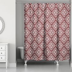 a red and white shower curtain in a bathroom