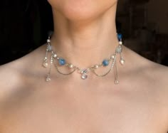 This handmade beaded Blue Fairy Necklace is made with glass, acrylic, and resin beads, with stainless steel chains.  ✧ Size: 12 inches with a 2-inch extender (adjustable to 14 inches). Perfect for those with a petite neck. If you need a larger or smaller size, message me with your desired measurements! I can add more beads and/or a second extender.  ✧ Closure: Lobster claw ✧ Care: For longevity, please keep away from water and perfumes. If you have any questions, feel free to reach out ♡ For more, visit my shop: https://www.etsy.com/shop/stardropstop Water Inspired Jewelry, Beaded Necklace Ideas Handmade, Necklace Reference, Coquette Necklace, Cottagecore Necklace, Necklace Fairycore, Bracelet Stuff, Cottagecore Jewelry, Y2k Necklace