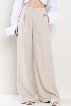 Enhance your wardrobe with our Nude Wide Leg Pants. Made with a flattering wide leg design and convenient pockets, these pants offer both style and functionality. Perfect for any occasion, these pants are a must-have for any fashion-forward individual. Elevate your look and stay on trend with these versatile and comfortable pants. Fabric & fit: 100% polyester Model is wearing size Small. Versatile Wide Leg Pants For Business Casual With Pockets, Relaxed Fit Ankle-length Wide Leg Pants For Business Casual, Office Wide Leg Relaxed Fit Pants, Relaxed Fit Wide Leg Office Pants, Full Length Pants For Business Casual In Summer, Summer Business Casual Full Length Pants, Full Length Smart Casual Summer Pants, Full Length Business Casual Summer Pants, Versatile Beige High-waisted Wide Leg Pants