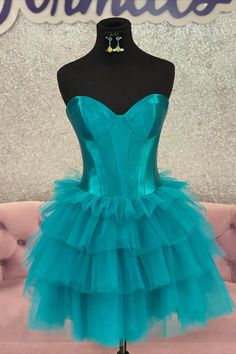 A-Line Turquoise Corset Tiered Short Homecoming Dress Fitted Tulle Mini Dress With Sweetheart Neckline, Sweetheart Neckline Mini Dress With Corset Back For Homecoming, Heart-shaped Neckline Corset Dress For Homecoming, Homecoming Mini Dress With Sweetheart Neckline And Ruched Bodice, Tulle Mini Dress With Corset Back And Sweetheart Neckline, Flirty Fitted Bodice Corset Dress For Prom, Flirty Corset Dress With Fitted Bodice For Prom, Sweetheart Neckline Mini Dress With Ruched Bodice For Homecoming, Corset Dress With Heart-shaped Neckline For Prom