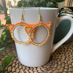 As someone with two orange cats, I can confirm that they are, in fact, like that. Handmade beaded frame earrings featuring Toho seed beads and other various beads. Made with a combination of Fireline and Nymo beading thread, these earrings are sturdy and secure. Made on the traditional and unceded territories of the Qayqayt First Nation, and other Halq'eméylem speaking peoples. Orange Beaded Hoop Earrings As A Gift, Orange Beaded Hoop Earrings For Gift, Orange Hoop Beaded Earrings As Gift, Orange Beaded Hoop Earrings, Orange Hoop Earrings With Colorful Beads For Gift, Handmade Orange Hoop Earrings, Beaded Frame, Beading Thread, Orange Cats