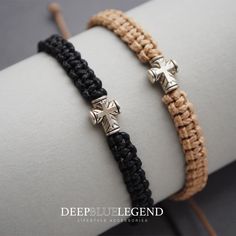 two braided bracelets with crosses on them