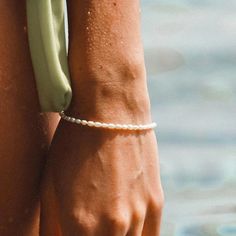 A true (summer) stunner, our Freshwater Pearl Bracelet gives you that warm fuzzy feeling of long summer days and fun in the sun. Each tiny pearl that's strung along this bracelet is different and unique, just like you! A precious piece of jewelry made from high quality stainless steel and coated in real 14K gold plated. We added a slightly longer extender so our Freshwater Pearl Bracelet fits all. Handcrafted with genuine mini freshwater pearls Adjustable length: 5.9” + 1.1” extender 925 Sterlin True Summer, Freshwater Pearl Bracelet, Fun In The Sun, Accessories Bracelets, Pearl Bracelet, Summer Days, Fresh Water, Freshwater Pearls, Like You