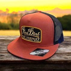 This Red Dirt Hat Co. snapback is burnt orange with black mesh has the flat bill style and features a patch with gold writing. Burnt Orange Front Black Mesh Back 5 Panel Red Dirt Patch Adjustable Snapback Flat Bill 08.24 Gold Writing, Snap Back Hat, Red Panels, Red Dirt, Western Store, Western Hats, Cowgirl Western, Snap Backs, Ball Cap