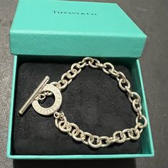 Brand New. Never Used. Silver Toggle Bracelet Size Medium. Elegant And Classic. No Return And No Low Balls. Chic Formal Jewelry With Toggle Clasp, Elegant Formal Chain Bracelet, Oval Link Bracelets With Clasp, Luxury Everyday Jewelry With Toggle Clasp, Timeless Formal Bracelets With Toggle Clasp, White Gold Bracelets With Clasp, Modern Toggle Clasp Chain Bracelet For Formal Occasions, Modern Chain Bracelet With Toggle Clasp For Formal Occasions, Modern Formal Chain Bracelet With Toggle Clasp