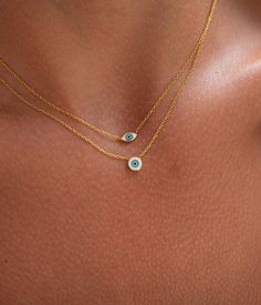 Premium Materials: Expertly crafted from high-quality 925 sterling silver over 14k gold plated or rhodium , ensuring durability and a radiant shine. 💙 Length:16"+2" Combine charm and protection with our Evil Eye Necklace. This unique piece features a heart-shaped pendant with the iconic evil eye symbol, designed to ward off negative energy while adding a touch of elegance to your look. Design: The third eye pendant beautifully incorporates the evil eye symbol, making it both a protective talisman and a stylish accessory. Versatile: Perfect for everyday wear or as a statement piece for special occasions. Perfect Gift: Comes in an elegant gift box, making it an ideal present for birthdays, anniversaries, or any special occasion. **Care Instructions To keep your necklace looking its best, av Gold Evil Eye Jewelry, Gold Evil Eye Necklace, Lucky Necklace, Eye Pendant Necklace, Evil Eye Necklace Gold, Eye Symbol, Necklace Minimalist, Eye Pendant, Evil Eye Pendant