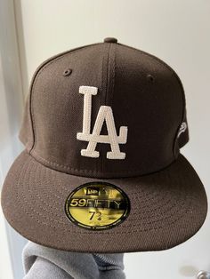 *NEW/NEVER WORN* I bought this hat not knowing the correct size for myself. So this hat has never been worn.  Size: 7 3/4 Color: Walnut Brown The emblem is a woven stick that looks so unique.  This is the perfect hat for any Dodgers fan!  Comes from a smoke-free home.  Please feel free to reach out with any questions! ALL SALES ARE FINAL Brown Fitted Hat With Flat Bill For Streetwear, Brown Flat Bill Fitted Hat For Streetwear, Brown Flat Brim Hat For Streetwear, Brown Snapback Hat With Embroidered Logo And Flat Brim, Brown Flat Brim Snapback Hat With Embroidered Logo, Brown Flat Brim Hat For Baseball Season, Brown Flat Brim Fitted Hat For Streetwear, Brown Flat Brim Baseball Cap, One Size Fits Most, Brown Flat Brim Baseball Cap One Size